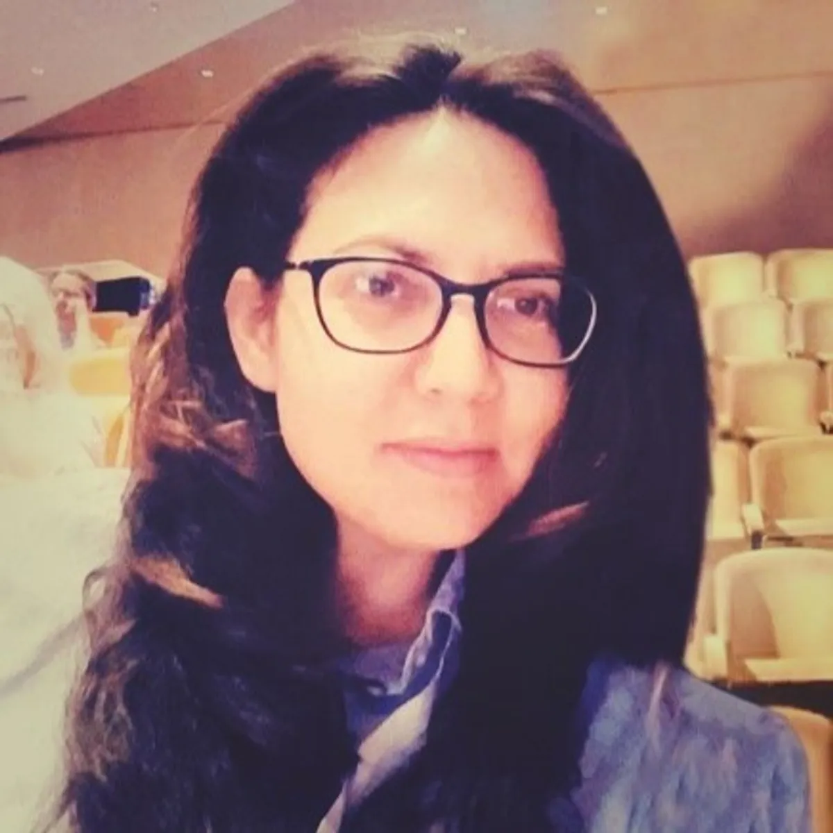 white and black Polaroid One Step 2 instant camera on white board